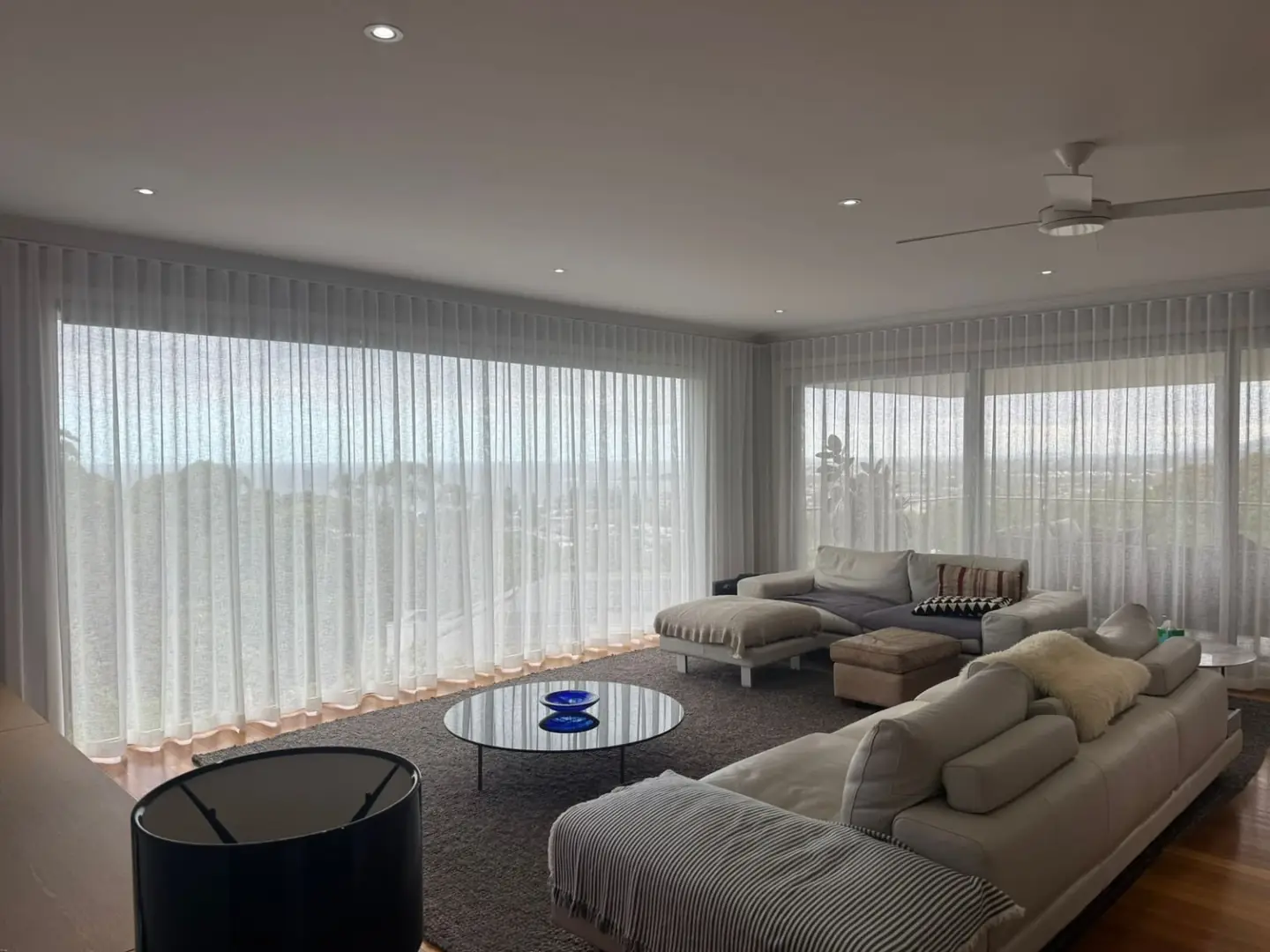 Wraparound sheer curtains in a living room