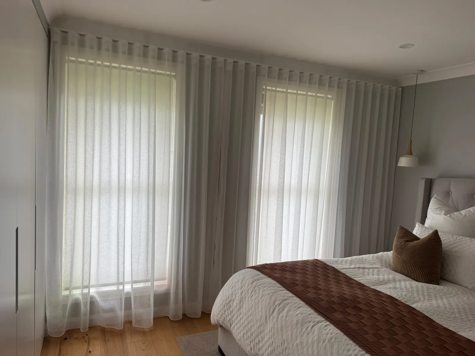 Sheer curtains on tall bedroom windows in Currans Hill